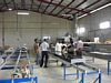 Another photo of the press factory tour. Showing factory layout.